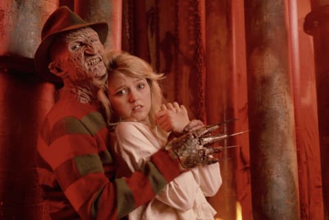 Freddy Krueger (Robert Englund) has Kirsten (Tuesday Knight) in his clutches in "A Nightmare on Elm Street 4: The Dream Master."