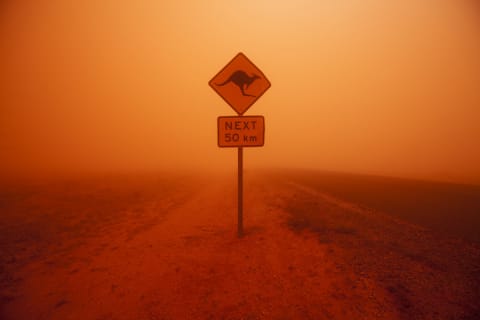 A red dust storm in the Australian outback.