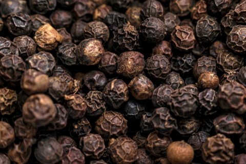 Dried black peppercorns.