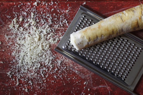 Whole horseradish next to the grated version.