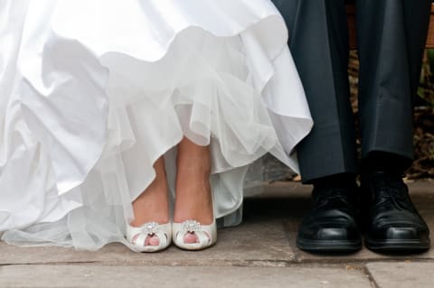 According to this tradition, her foot should stay in front of his.