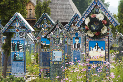 Hand-carved grave stones in Romania’s Merry Cemetery.