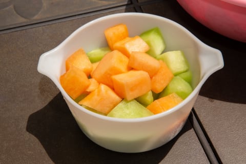 Cantaloupe (orange) and honeydew (green) are common fixtures in fruit salad.