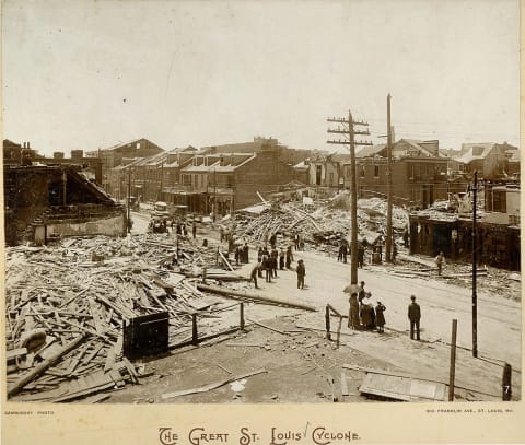 A street scene in St. Louis, Missouri, showing the swath of complete destruction between less-damaged buildings following the 1896 tornado.