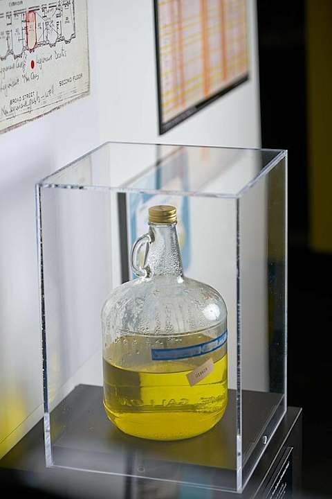 An exhibit at the CDC museum of a glass jug containing water from the HVAC system in the Bellevue-Stratford Hotel in Philadelphia, the place where Legionnaires’ disease was discovered.