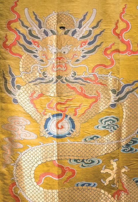 A silk panel depicting a dragon dyed with finely ground imperial yellow.