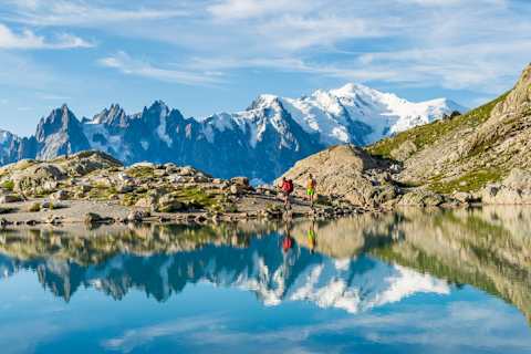 Two hikers along Lac Blanc on the Tour du Mont Blanc.