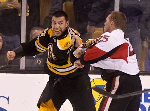 BOSTON – APRIL 28: Boston Bruins Milan Lucic fights Ottawa Senators Chris Neil during the first period. The Boston Bruins hosted the Ottawa Senators at TD Garden on Sunday, April 28, 2013. (Photo by Matthew J. Lee/The Boston Globe via Getty Images)