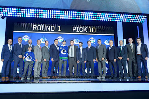 VANCOUVER, BC – JUNE 21: Vasily Podkolzin poses for a photo onstage after being selected tenth overall by the Vancouver Canucks during the first round of the 2019 NHL Draft at Rogers Arena on June 21, 2019 in Vancouver, British Columbia, Canada. (Photo by Derek Cain/Icon Sportswire via Getty Images)