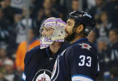 Nov 15, 2016; Winnipeg, Manitoba, CAN; Winnipeg Jets goalie Connor Hellebuyck (37) celebrates his shutout and win over the Chicago Blackhawks after the third period at MTS Centre. Winnipeg won 4-0. Mandatory Credit: Bruce Fedyck-USA TODAY Sports