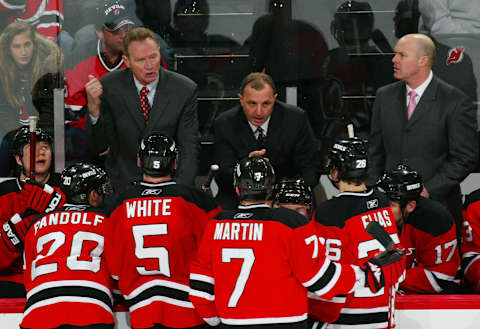 NEWARK, NJ – APRIL 06: (L-R) Coaches Larry Robinson, Brent Sutter and John MacLean of the New Jersey Devils give last minute instructions to their team in the final regular season game against the New York Rangers at the Prudential Center April 6, 2008 in Newark, New Jersey. The Devils beat the Rangers 3-2. (Photo by Bruce Bennett/Getty Images)