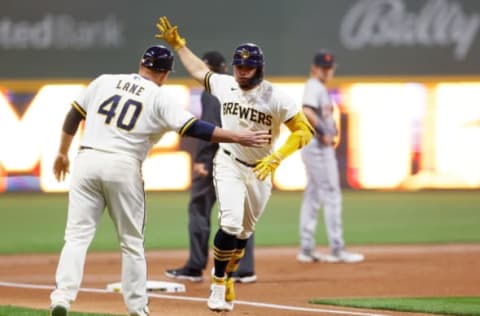 MILWAUKEE, WISCONSIN – APRIL 24: William Contreras #24 of the Milwaukee Brewers is congratulated by third base coach Jason Lane #40 after Contreras hit a solo home run in the first inning against the Detroit Tigers at American Family Field on April 24, 2023 in Milwaukee, Wisconsin. (Photo by John Fisher/Getty Images)