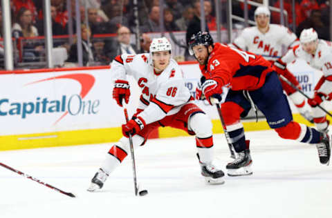 WASHINGTON, DC – JANUARY 13: Teuvo Teravainen #86 of the Carolina Hurricanes skates with the puck in front of Tom Wilson #43 of the Washington Capitals in the third period at Capital One Arena on January 13, 2020 in Washington, DC. (Photo by Rob Carr/Getty Images)