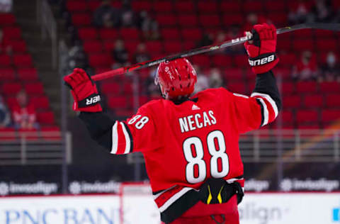 Mar 20, 2021; Raleigh, North Carolina, USA; Carolina Hurricanes center Martin Necas (88) reacts after missing his shot attempt during the overtime against the Columbus Blue Jackets at PNC Arena. Mandatory Credit: James Guillory-USA TODAY Sports