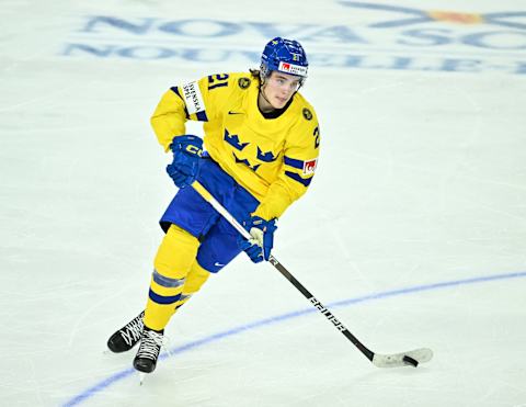 HALIFAX, CANADA – DECEMBER 31: Leo Carlsson #21 of Team Sweden skates the puck during the second period against Team Canada in the 2023 IIHF World Junior Championship at Scotiabank Centre on December 31, 2022 in Halifax, Nova Scotia, Canada. Team Canada defeated Team Sweden 5-1. (Photo by Minas Panagiotakis/Getty Images)