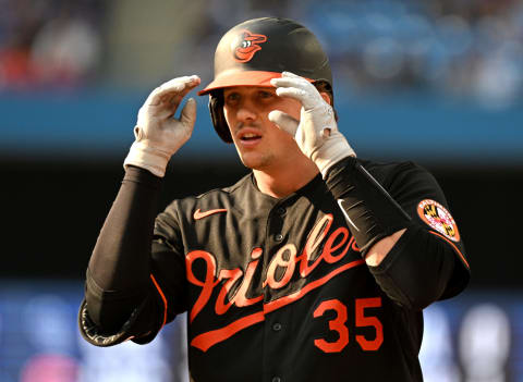 Sep 17, 2022; Toronto, Ontario, CAN; Baltimore Orioles catcher Adley Rutschman (35) gestures to team mates after hitting a single against the Toronto Blue Jays in the fourth inning at Rogers Centre. Mandatory Credit: Dan Hamilton-USA TODAY Sports