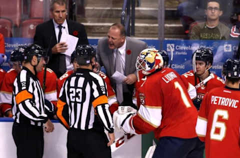 Nov 7, 2016; Sunrise, FL, USA; Florida Panthers head coach Gerard Gallant and goalie Roberto Luongo (1) argue with linesman Bryan Pancich (94) and referees Justin StPierre (12) and Brad Watson after a goal by Tampa Bay Lightning left wing Ondrej Palat (not pictured) in the third period at BB&T Center. The Panthers won 3-1. Mandatory Credit: Robert Mayer-USA TODAY Sports