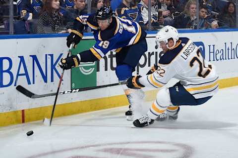 ST. LOUIS, MO – DECEMBER 27: Jay Bouwmeester #19 of the St. Louis Blues attempts to clear the puck as Johan Larsson #22 of the Buffalo Sabres pressures at Enterprise Center on December 27, 2018 in St. Louis, Missouri. (Photo by Joe Puetz/NHLI via Getty Images)