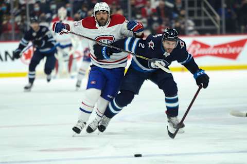 Montreal Canadiens, Mathieu Perreault (85); Winnipeg Jets, Dylan DeMelo (2). Mandatory Credit: Terrence Lee-USA TODAY Sports