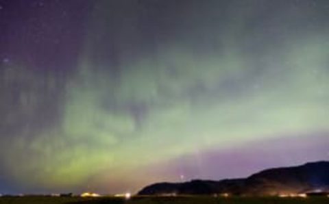 There are spectacular light shows in northern Sweden known as the “aurora borealis,” or “northern lights.” The dazzling green or red lights, which fill the late night sky, are caused by collisions of tiny particles high in the Earth’s atmosphere.