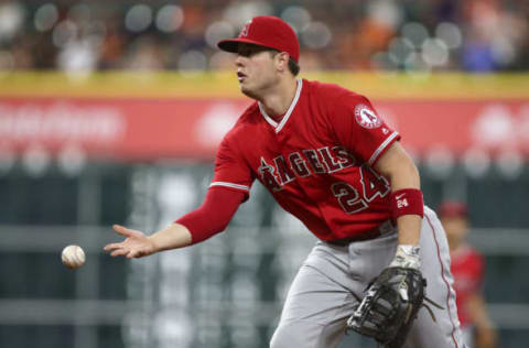 Sep 23, 2016; Houston, TX, USA; Los Angeles Angels first baseman C.J. Cron (24) tosses the ball to first base for an out during the first inning against the Houston Astros at Minute Maid Park. Mandatory Credit: Troy Taormina-USA TODAY Sports. MLB.