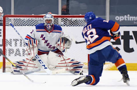 UNIONDALE, NEW YORK – APRIL 20: Josh Bailey #12 of the New York Islanders scores his second goal of the game during the third period against Igor Shesterkin #31 of New York Rangers at the Nassau Coliseum on April 20, 2021, in Uniondale, New York. The Islanders defeated the Rangers 6-1. (Photo by Bruce Bennett/Getty Images)