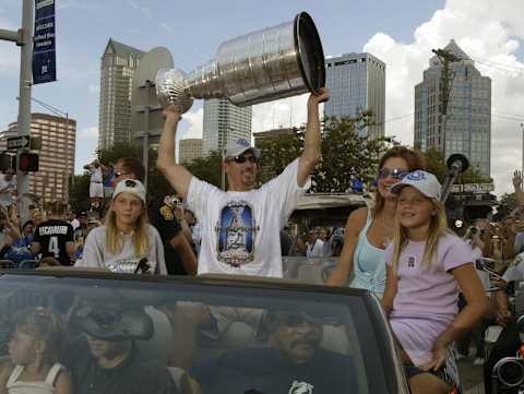 TAMPA, FL – JUNE 9: Tampa Bay Lightning Captain Dave Andreychuk holds up the NHL Stanley Cup trophy during a victory parade June 9, 2004 in Tampa, Florida. The Lightning beat the Calgary Flames in Game 7 for the championship. (Photo by Chris Livingston/Getty Images)