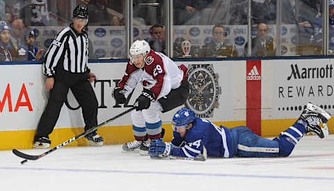 TORONTO, ON – JANUARY 14: Nathan MacKinnon #29 of the Colorado Avalanche skates past a down Morgan Rielly #44 of the Toronto Maple Leafs during an NHL game at Scotiabank Arena on January 14, 2019 in Toronto, Ontario, Canada. The Avalanche defeated the Maple Leafs 6-3. (Photo by Claus Andersen/Getty Images)