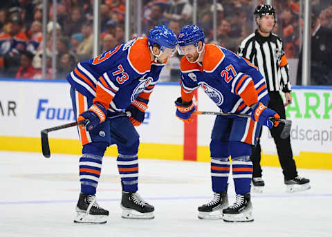 EDMONTON, CANADA – OCTOBER 26: Vincent Desharnais #73 and Brett Kulak #27 of the Edmonton Oilers talk strategy in the second period against the New York Rangers on October 26, 2023 at Rogers Place in Edmonton, Alberta, Canada. (Photo by Lawrence Scott/Getty Images)