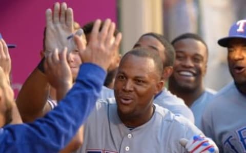 Apr 9, 2016; Anaheim, CA, USA; Texas Rangers third baseman Adrian Beltre (29) celebrates with teammates in the dugout after hitting a solo home run in the fourth inning against the Los Angeles Angels at Angel Stadium of Anaheim. Mandatory Credit: Jayne Kamin-Oncea-USA TODAY Sports