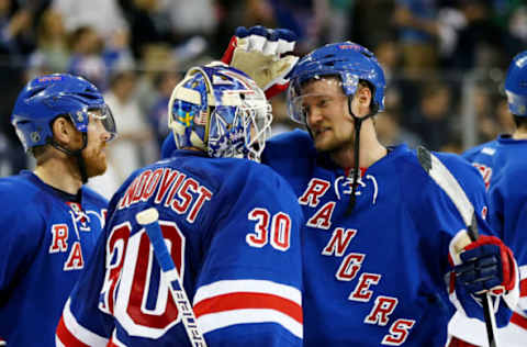 NEW YORK, NY – MAY 11: Henrik Lundqvist #30 celebrates their 3 to 1 win over the Pittsburgh Penguins with Anton Stralman #6 of the New York Rangers during Game Six of the Second Round of the 2014 NHL Stanley Cup Playoffs at Madison Square Garden on May 11, 2014 in New York City. (Photo by Elsa/Getty Images)