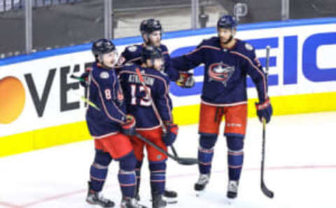 TORONTO, ONTARIO – AUGUST 17: Cam Atkinson #13 of the Columbus Blue Jackets is congratulated by his teammates after scoring a goal at 5:48 against the Tampa Bay Lightning during the second period in Game Four of the Eastern Conference First Round during the 2020 NHL Stanley Cup Playoffs at Scotiabank Arena on August 17, 2020 in Toronto, Ontario. (Photo by Elsa/Getty Images)