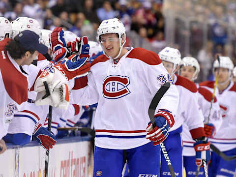 Jan 7, 2017; Toronto, Ontario, CAN; Montreal Canadiens forward Michael McCarron (34) celebrates with team mates after scoring against Toronto Maple Leafs in the third period of a 5-3 win at Air Canada Centre. Mandatory Credit: Dan Hamilton-USA TODAY Sports