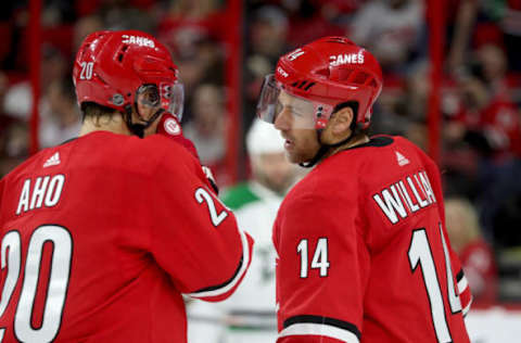 RALEIGH, NC – FEBRUARY 16: Justin Williams #14 of the Carolina Hurricanes discusses strategy with teammate Sebastian Aho #20 during an NHL game against the Dallas Stars on February 16, 2019 at PNC Arena in Raleigh, North Carolina. (Photo by Gregg Forwerck/NHLI via Getty Images)