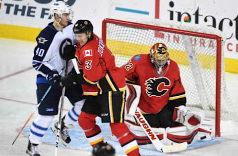 Oct 2, 2016; Calgary, Alberta, CAN; Calgary Flames goalie Jon Gillies (32) stops a shot from the Winnipeg Jets at Scotiabank Saddledome. The Jets won 4-0. Mandatory Credit: Candice Ward-USA TODAY Sports