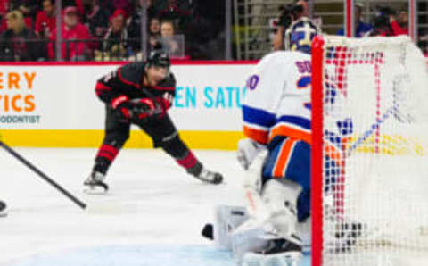 Apr 2, 2023; Raleigh, North Carolina, USA; New York Islanders goaltender Ilya Sorokin (30) stops the scoring attempt by Carolina Hurricanes left wing Jordan Martinook (48) during the first period at PNC Arena. Mandatory Credit: James Guillory-USA TODAY Sports