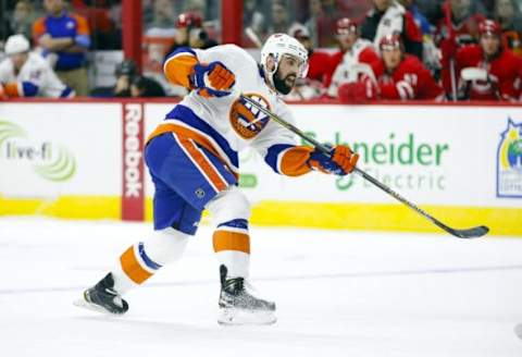 Feb 13, 2016; Raleigh, NC, USA; New York Islanders defensemen Nick Leddy (2) takes a shot against the Carolina Hurricanes at PNC Arena. The Carolina Hurricanes defeated the New York Islanders 6-3. Mandatory Credit: James Guillory-USA TODAY Sports