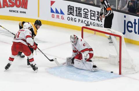 BOSTON, MA – DECEMBER 3: Charlie Coyle #13 of the Boston Bruins scores against James Reimer #47 of the Carolina Hurricanes at the TD Garden on December 3, 2019 in Boston, Massachusetts. (Photo by Steve Babineau/NHLI via Getty Images)