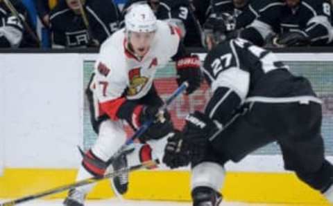 Jan 16, 2016; Los Angeles, CA, USA; Los Angeles Kings defenseman Alec Martinez (27) defends Ottawa Senators center Kyle Turris (7) in the first period of the game at Staples Center. Mandatory Credit: Jayne Kamin-Oncea-USA TODAY Sports