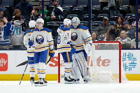 COLUMBUS, OH – DECEMBER 07: Ukko-Pekka Luukkonen #1 of the Buffalo Sabres is congratulated by Zemgus Girgensons #28 after defeating the Columbus Blue Jackets at Nationwide Arena on December 7, 2022 in Columbus, Ohio. Buffalo defeated Columbus 9-4. (Photo by Kirk Irwin/Getty Images)