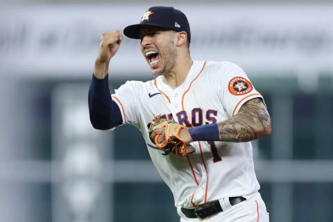 HOUSTON, TEXAS – OCTOBER 22: Carlos Correa #1 of the Houston Astros celebrates after tagging out Alex Verdugo #99 of the Boston Red Sox (not pictured) as he attempted to steal second base during the seventh inning in Game Six of the American League Championship Series at Minute Maid Park on October 22, 2021 in Houston, Texas. (Photo by Elsa/Getty Images)