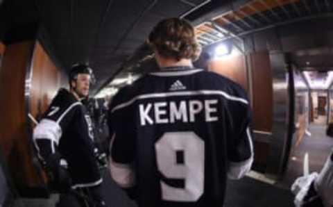 LOS ANGELES, CA – APRIL 7: Adrian Kempe #9 and Oscar Fantenberg #7 of the Los Angeles Kings converse before a game against the Dallas Stars at STAPLES Center on April 7, 2018 in Los Angeles, California. (Photo by Adam Pantozzi/NHLI via Getty Images) *** Local Caption ***