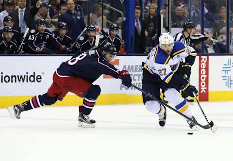 Nov 17, 2015; Columbus, OH, USA; Columbus Blue Jackets left wing Rene Bourque (18) attempts a play at the puck against St. Louis Blues defenseman Alex Pietrangelo (27) in the third period at Nationwide Arena. The Blue Jackets won 3-1. Mandatory Credit: Aaron Doster-USA TODAY Sports