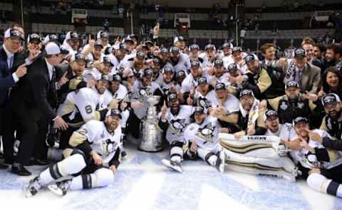 Jun 12, 2016; San Jose, CA, USA; Pittsburgh Penguins players pose for a team photo with the Stanley Cup after defeating the San Jose Sharks in game six of the 2016 Stanley Cup Final at SAP Center at San Jose. Mandatory Credit: Gary A. Vasquez-USA TODAY Sports