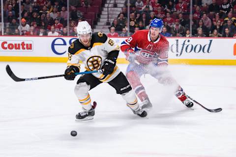 MONTREAL, QC – DECEMBER 17: Boston Bruins right wing David Pastrnak (88) and Montreal Canadiens defenseman Mike Reilly (28) battle for the puck during the third period of the NHL game between the Boston Bruins and the Montreal Canadiens on December 17, 2018, at the Bell Centre in Montreal, QC (Photo by Vincent Ethier/Icon Sportswire via Getty Images)