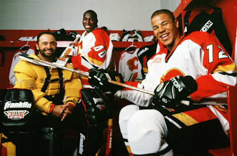 CALGARY, AB – SEPTEMBER 16: Grant Fuhr #31, Fred Brathwaite #40 and Jarome Iginla #12 of the Calgary Flames posing in the locker room on September 16, 1999 in Calgary, Alberta. (Photo by Ronald C. Modra/Sports Imagery/Getty Images)