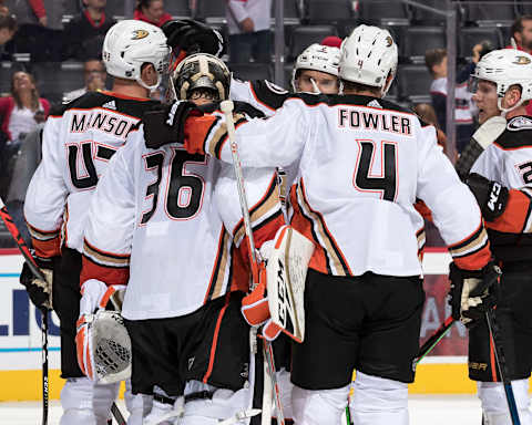 DETROIT, MI – OCTOBER 08: Goaltender John Gibson #36 of the Anaheim Ducks is congratulated by teammates Josh Manson #42, Brendan Guhle #2 and Cam Fowler #4 following an NHL game against the Detroit Red Wings at Little Caesars Arena on October 8, 2019 in Detroit, Michigan. Anaheim defeated Detroit 3-1. (Photo by Dave Reginek/NHLI via Getty Images)