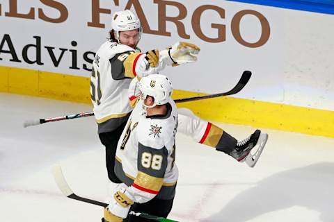 Mark Stone #61 of the Vegas Golden Knights is congratulated by his teammate Nate Schmidt #88 after scoring a goal against the St. Louis Blues during the Third period in a Western Conference Round Robin game. (Photo by Jeff Vinnick/Getty Images)