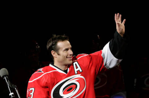 Carolina Hurricanes Ray Whitney (13) waves to the crowd as he is honored for having played in his 1000th NHL game. (Chris Seward/Raleigh News & Observer/MCT via Getty Images)