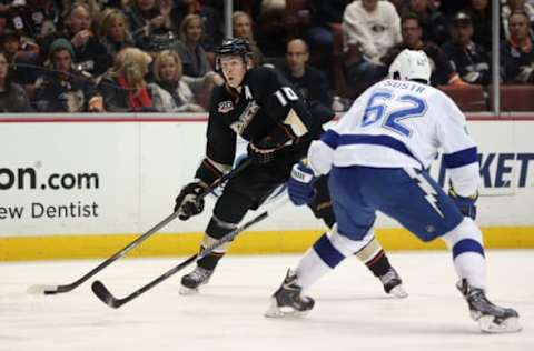 ANAHEIM, CA: Corey Perry #10 of the Anaheim Ducks and Andrej Sustr #62 of the Tampa Bay Lightning fight for the puck at Honda Center on November 22, 2013. (Photo by Jeff Gross/Getty Images)